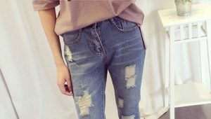 Bagaimana untuk membuat lubang-lubang yang bergaya dan seluar jeans pada seluar jeans