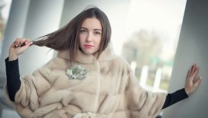 Stylish fur coat with a bat sleeve